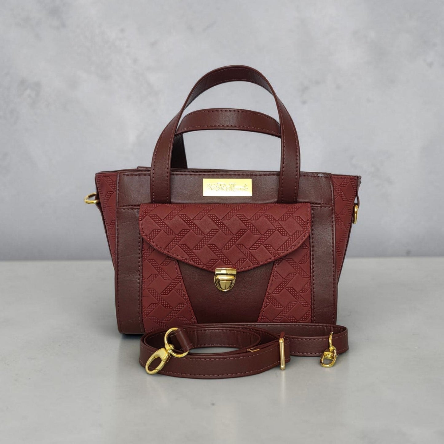 Burgundy quilted faux leather with gold hardware mini bag