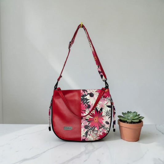 Red floral print slouch bag, matte black hardware.