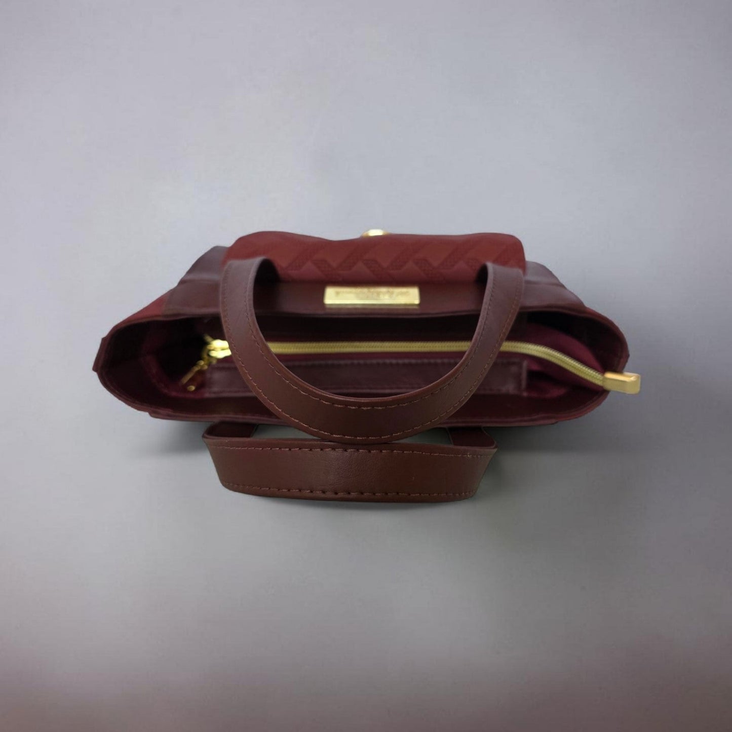 Burgundy quilted faux leather with gold hardware mini bag